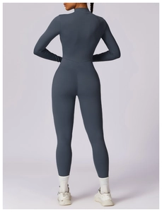 Macro detail of the seamless back design and fabric texture of the dark grey yoga bodysuit