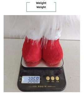 Close-up showing a weighted Christmas gnome plush on a scale measuring 386.8g