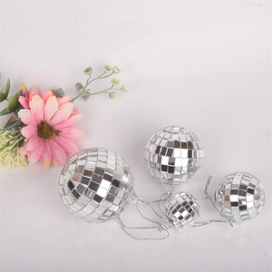 Set of four silver disco mirror balls in various sizes for wedding and party decoration