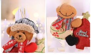 Detailed view of plush Christmas ornaments with Merry Christmas metallic text and knits