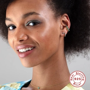 Detailed view of S925 sterling silver trinity earrings set with turquoise stones