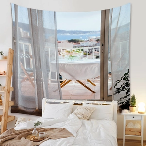 Detail of bohemian wall tapestry showing a realistic balcony ocean view for bedroom decor