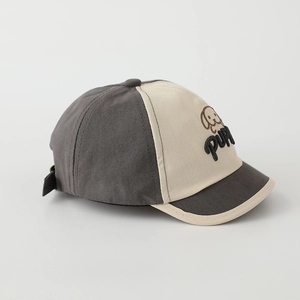 Close-up of adorable puppy embroidery and puppy text on toddler baseball cap
