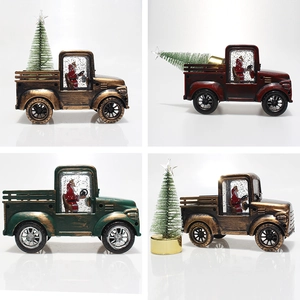 Detail of vintage Christmas truck ornaments with LED lights and swirling glitter