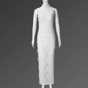 Macro detail of high-elastic white sleeveless dress featuring distressed fringe and cutout textures