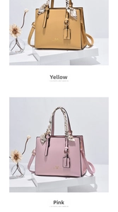 Detail of trendy small square handbags with silk scarf handles in yellow and pink