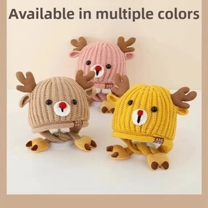 Detailed view of three knit baby deer hats with earflaps and plush animal ear accents