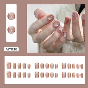 Champagne cat eye press-on nails with white butterfly patterns in short ballerina shape