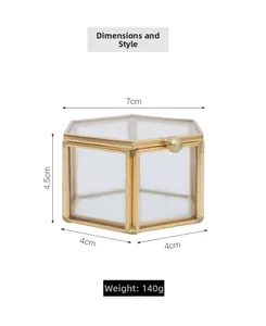 Detail view showing dimensions of hexagonal glass jewelry box with gold metal frame