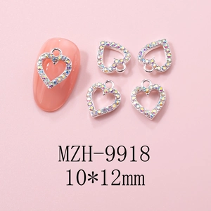 Macro detail of 10x12mm hollow heart nail charm with AB rhinestones for Y2K art design