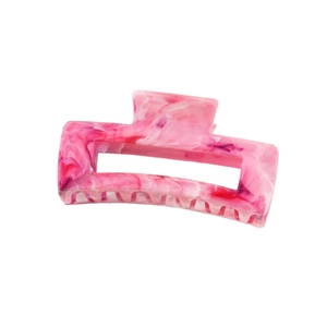 Detail of large square hair claw clip featuring pink marble acetate texture