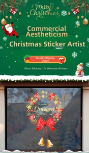 Detail of Christmas wreath window sticker with red bow, golden stars and festive ornaments