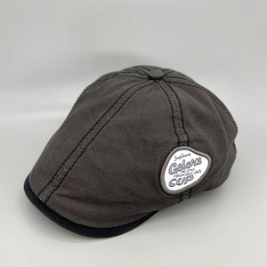 Detail view of the vintage cotton duckbill cap showing fine stitching and letter patch