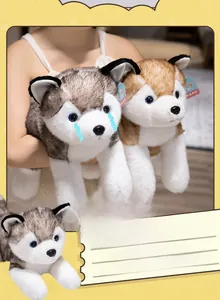 Detail of plush husky toys in grey and brown showing lifelike blue eyes and soft texture