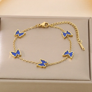 Detail of five butterfly pendants on golden titanium steel chain with blue enamel