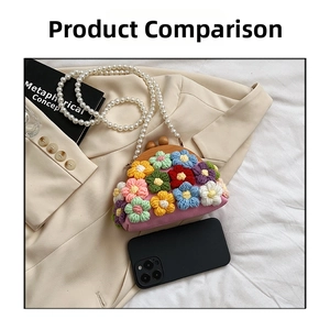 Handmade crochet floral shell bag with pearl strap beside a phone for scale