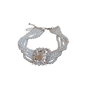 Luxurious multi-layer pearl choker with a sparkling square crystal pendant centerpiece