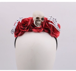 Detail of Gothic Halloween headband featuring red roses and decorative resin skull elements