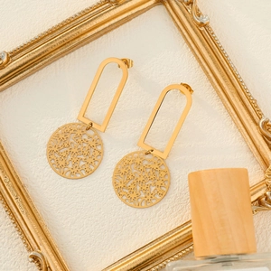 Elegant gold leaf geometric hollow earrings in stainless steel with a vintage luxury design