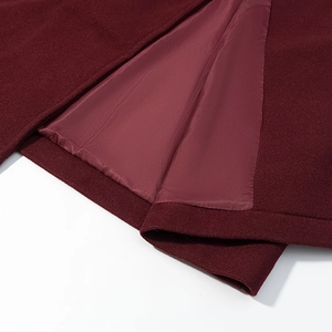 Elegant wine red double-breasted wool coat featuring premium lining and clean hem stitching