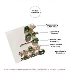 Detail view of five vintage emerald rhinestone and pearl hair clips on white card