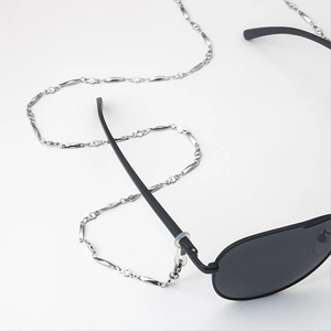 Polished stainless steel eyeglasses chain with diamond accents on a white background
