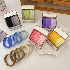 High elasticity seamless hair ties in gradient colors displayed in a decorative star plate
