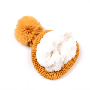 Winter mustard yellow knitted beanie with large faux fur pom and thick plush lining