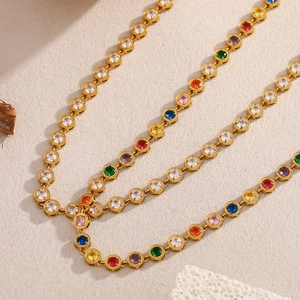 Detail of 18K gold plated stainless steel necklaces featuring multi-colored zircon stones