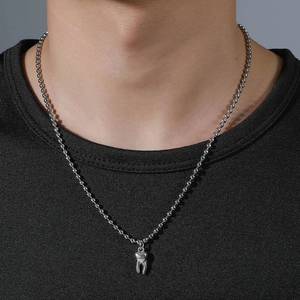 3D silver tooth pendant necklace with bead chain shown on male model in high detail