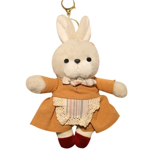 Portachiavi con coniglietto di peluche in abito arancione e grembiule di pizzo