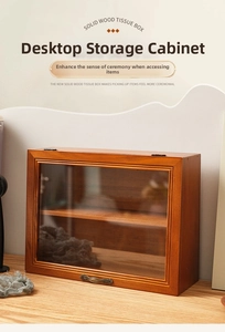 Detail view of vintage solid wood storage cabinet featuring glass door and bronze handle