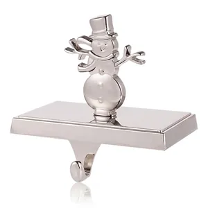 Polished silver snowman Christmas stocking holder with metal base and sturdy mantle hook
