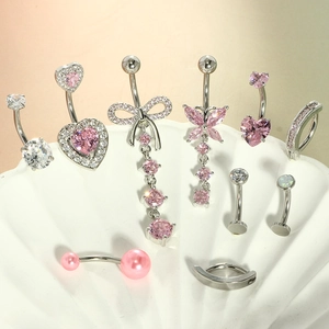 Macro shot of 10-piece pink belly button ring set with heart and butterfly charms
