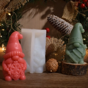 Detailed silicone mold for DIY Christmas gnome candles with festive ornaments