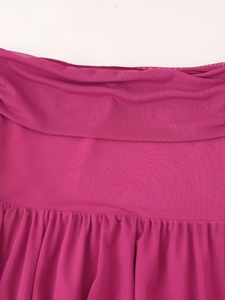Detail of rose red mesh fabric featuring elegant pleated layers and fine mesh texture