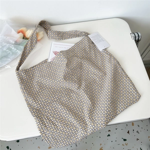 Detail of canvas tote bag with geometric print and comfortable wide shoulder strap