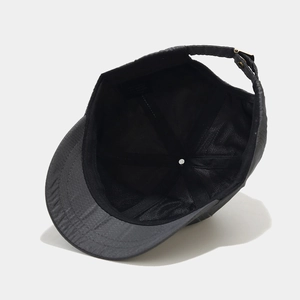Short brim baseball cap with quick-dry fabric showing interior lining and metal buckle