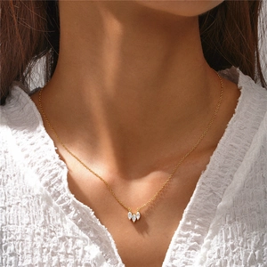 Detail of 925 silver necklace with three marquise-cut zircons worn on model neck