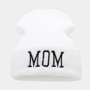 Close-up of MOM embroidery on a white winter knit beanie hat with detailed wool texture