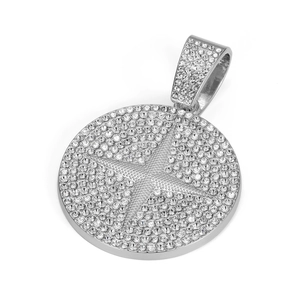 Detailed close-up of a silver-toned hip-hop medallion pendant with star crystal pavé