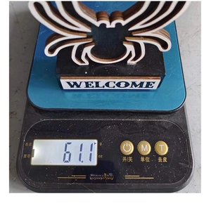 Spider wooden ornament with Welcome sign on scale weighing 61.1g for Halloween decor