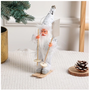 Detail view of Santa figurine in silver and white outfit with sequins and wooden skis