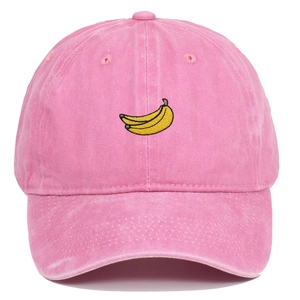 Pink washed cotton baseball cap featuring yellow banana fruit embroidery on the front
