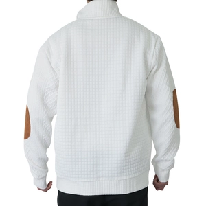 Macro detail of men's white quilted long sleeve top with brown elbow patches
