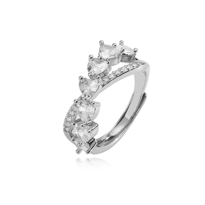 Macro shot of silver adjustable ring featuring five heart-shaped zircons and side accents
