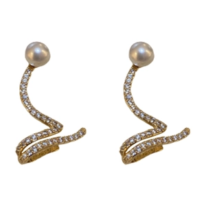 Elegant gold snake-shaped earrings with pearls and pavé zircons on white background