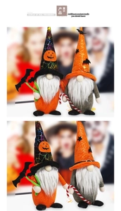 Detail view of two Halloween faceless gnomes with bat wings and striped canes