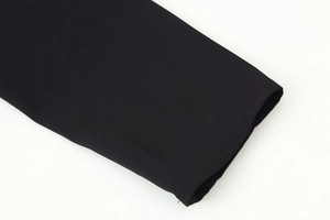 Close-up of sleeve cuff on a black casual two-piece set showing precise stitching detail