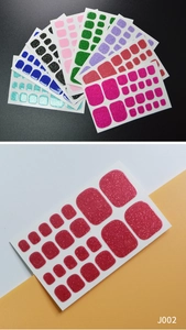 Macro shot of glitter toe nail polish stickers set J002 in sparkling pink finish